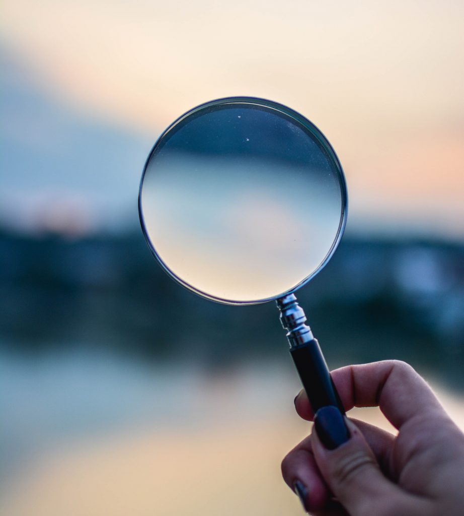 selective-focus-photo-of-magnifying-glass-1194775